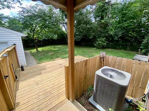 back door overlooking deck and fenced in yard