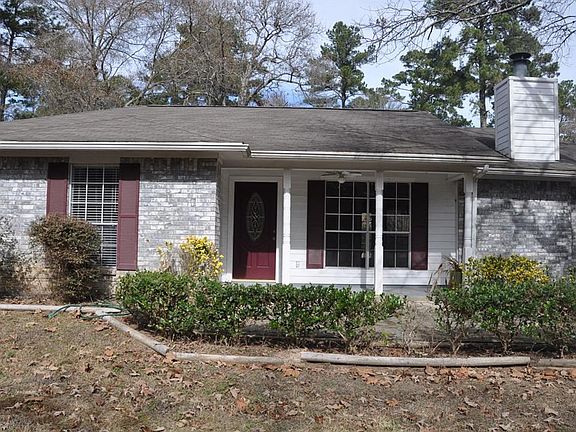 Come view the inside of your new home.  Walkway from the driveway and garage area lead up to the front porch.