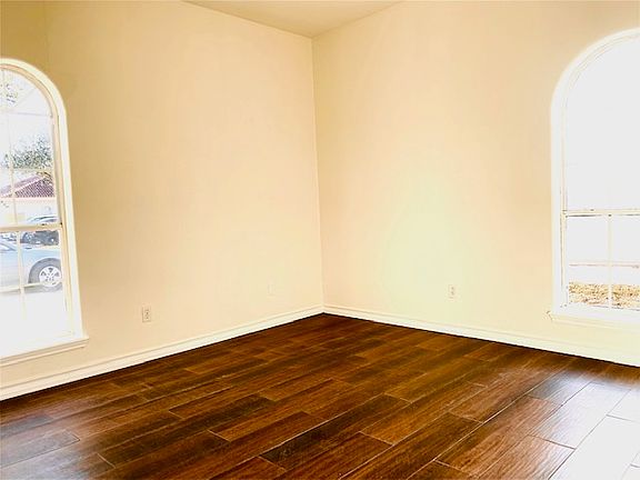 Bedroom one with hardwood tile and great large closet.