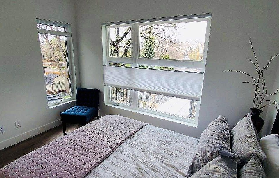 Bedroom has privacy shades but view of park across street. Wooded beautiful lot convenient to everything and secured with electronic gate and fully fenced in.
