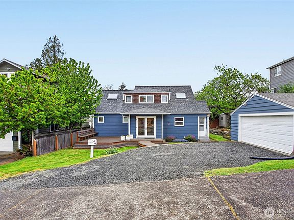 2 car garage & a side parking pad.>