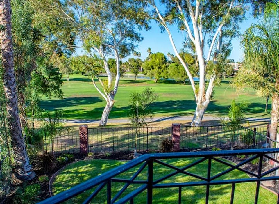 View of golf course from balcony in master bedroom.