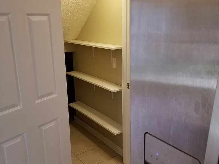 PANTRY/STORAGE ACROSS FROM KITCHEN