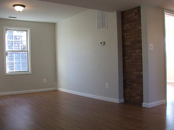 Exposed original brick in living room.