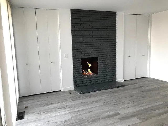 Primary ensuite that includes double closets, beautiful fireplace and balcony.