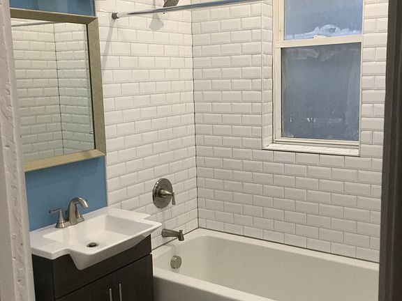 Bathroom with all new tub, sink, and fixtures