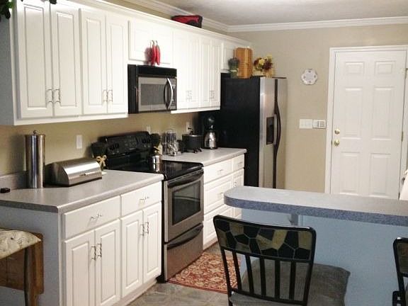 Kitchen- cabinets both sides & breakfast bar