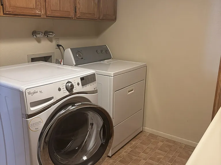 Laundry room with washer and dryer