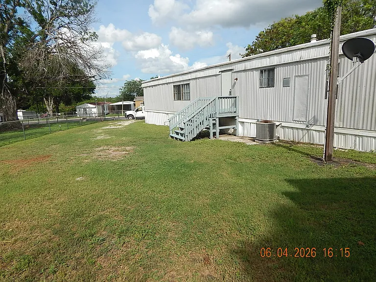 North side oof home -rear home entrance with deck