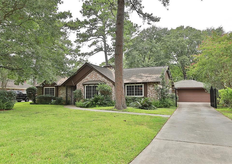 Lovely 3 bedroom/2 bath, 1 story home in Champions West on a large wooded 12,740 SF lot.