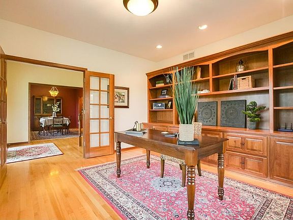 When you enter the home there is a WOW factor! Immediately to your right is this stunning office. With an abundance of built ins there is room to decorate and store! What a great place to get things done while still looking stately.