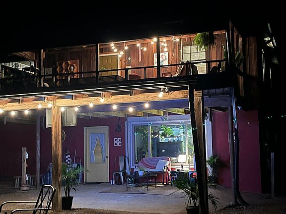 Outdoor spaces: Covered back porch and additional lower level