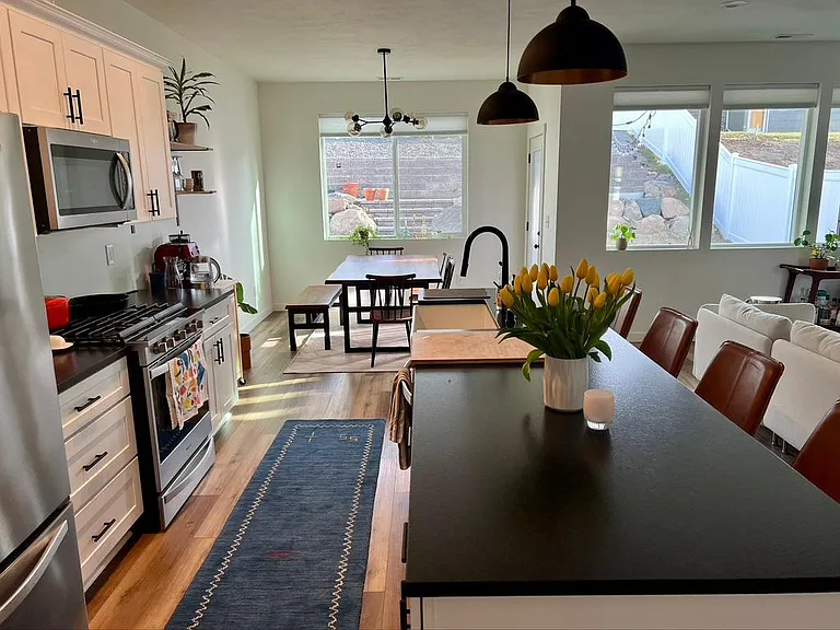 Farmhouse sink and large island with lots of room for food prep and entertaining.