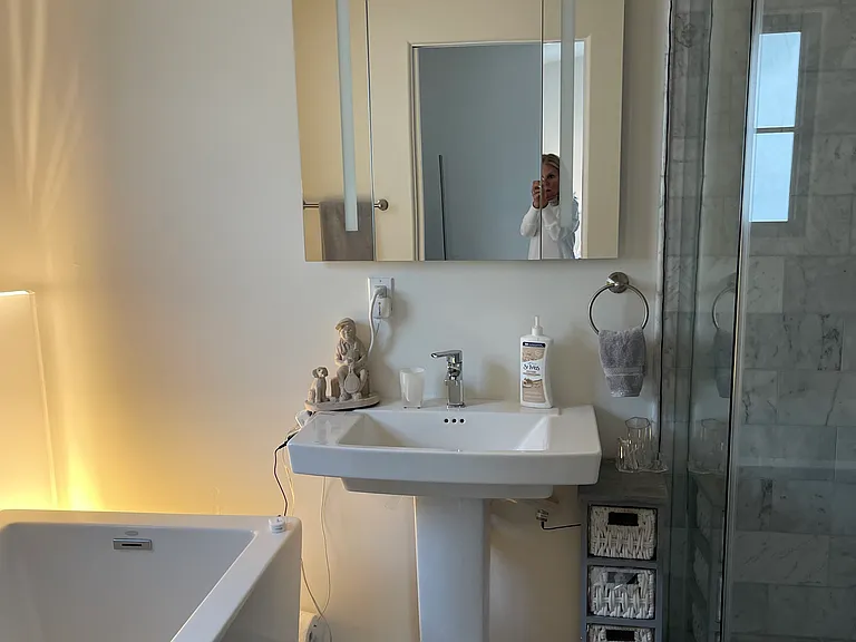 Primary bedroom bath, shower, sink and heated toilet seat