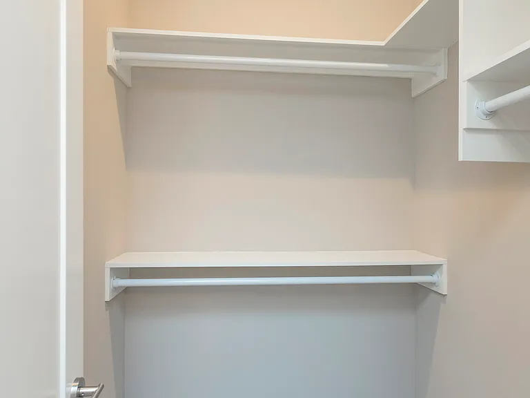 one of the two master bedroom closets