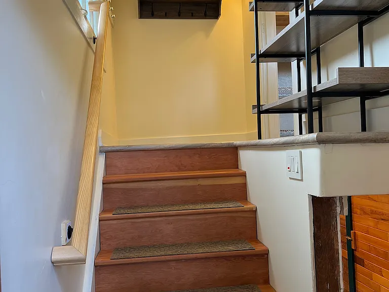 Stairs from kitchen to basement and rear entry