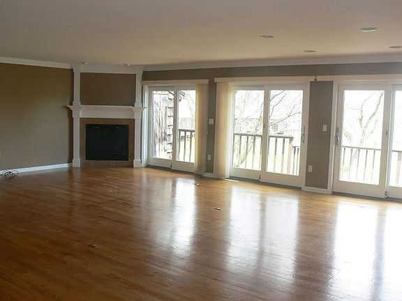 Main Floor Great Room with Gas Fireplace and Sliding Doors to Back Deck