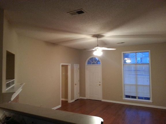 View from kitchen looking at the front door. Lots of high ceiling and natural light.