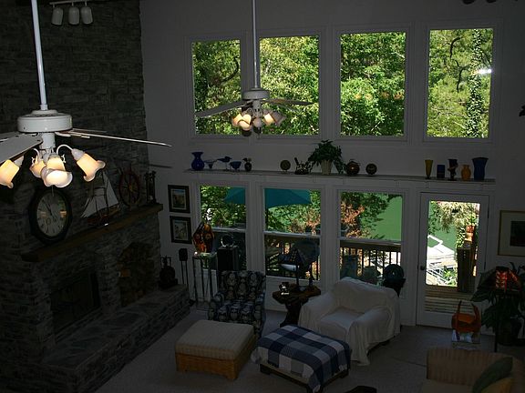 Great Room w/Wall of Windows Overlooking Lake