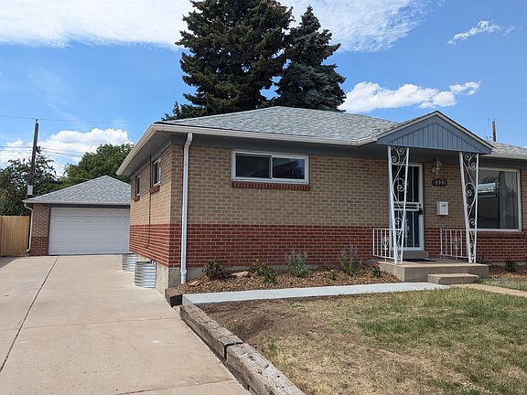 Detached 2 car garage behind home w long driveway