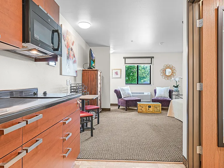 Kitchens include full sized fridge, cooktop range, and microwave.