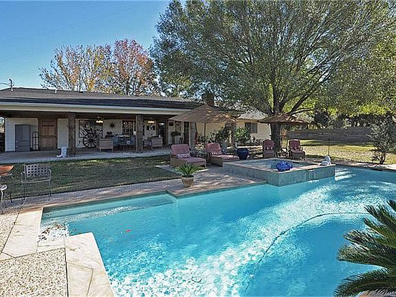 A view of the back of the home and patio.