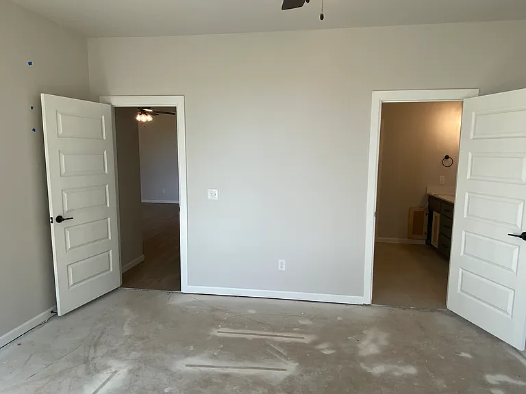 Primary Bedroom
Exit to Living Room on Left
Entrance to en suite Bathroom on right