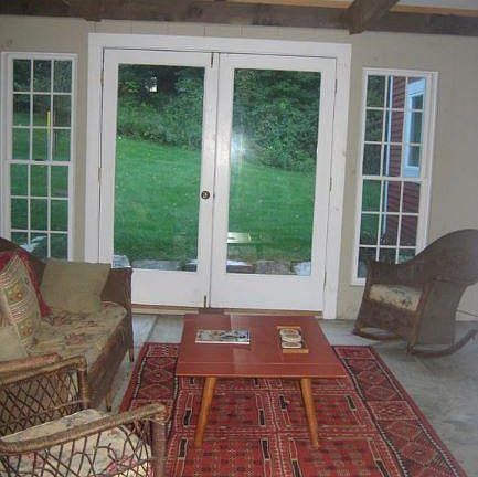 Sunroom has view to back yard.