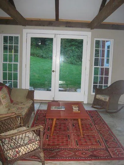 Sunroom has view to back yard.