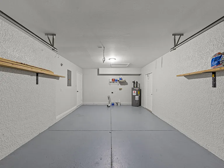 Garage with sealed floor, washer/dryer hook up and side access door