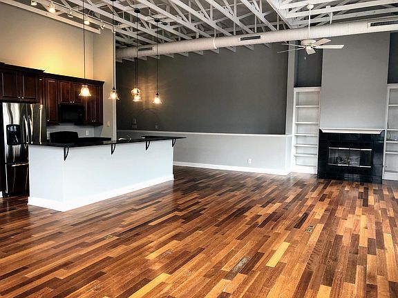 Beautiful kitchen with open living space with a gas fireplace