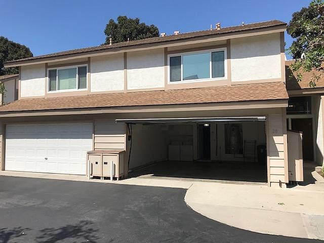 garage with storage and washing machine and dryer