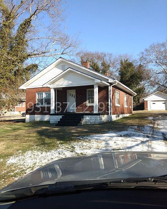 Brick exterior with detached garage