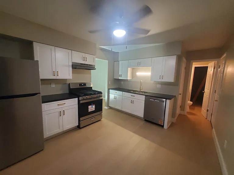 Kitchen. Back right is half bath