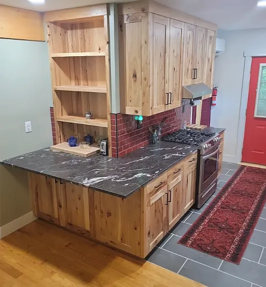 Artisan cabinetry and brand new stainless steel appliances.
