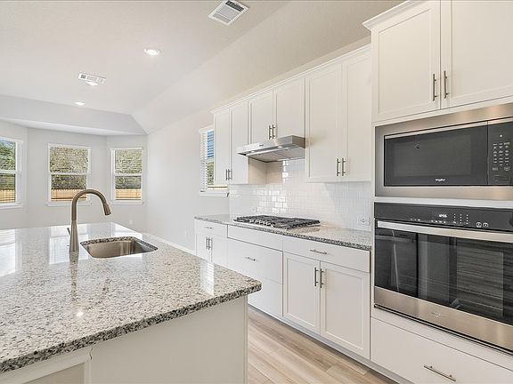 Enjoy lots of natural lighting in the kitchen and dining areas.