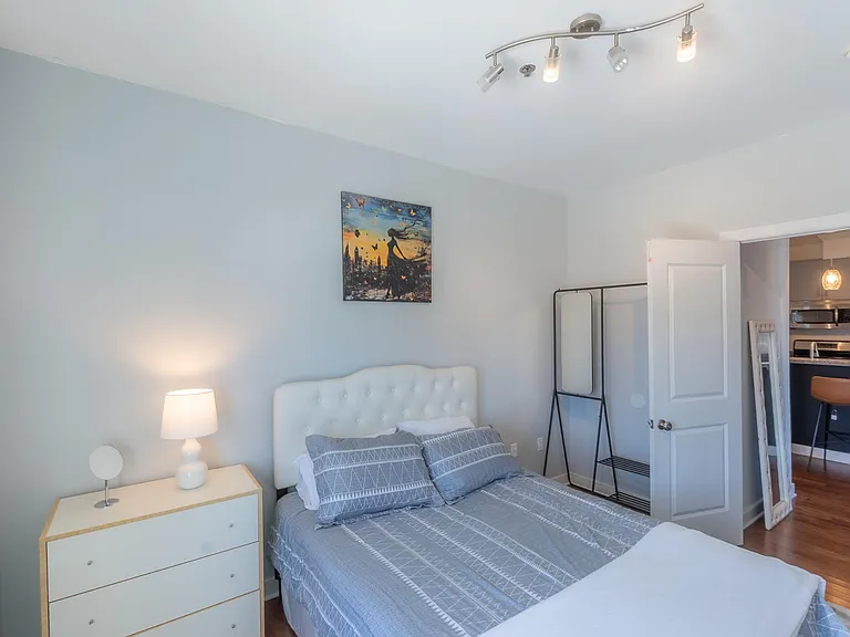 Furnished bedroom with a queen bed