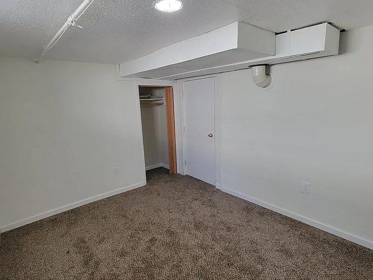 Downstairs bedroom looking towards closet