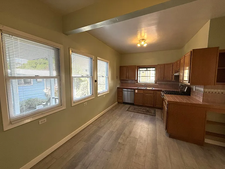 Kitchen with dishwasher, gas range, greenhouse window