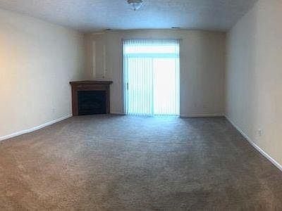 Living room with walkout to patio and backyard 
