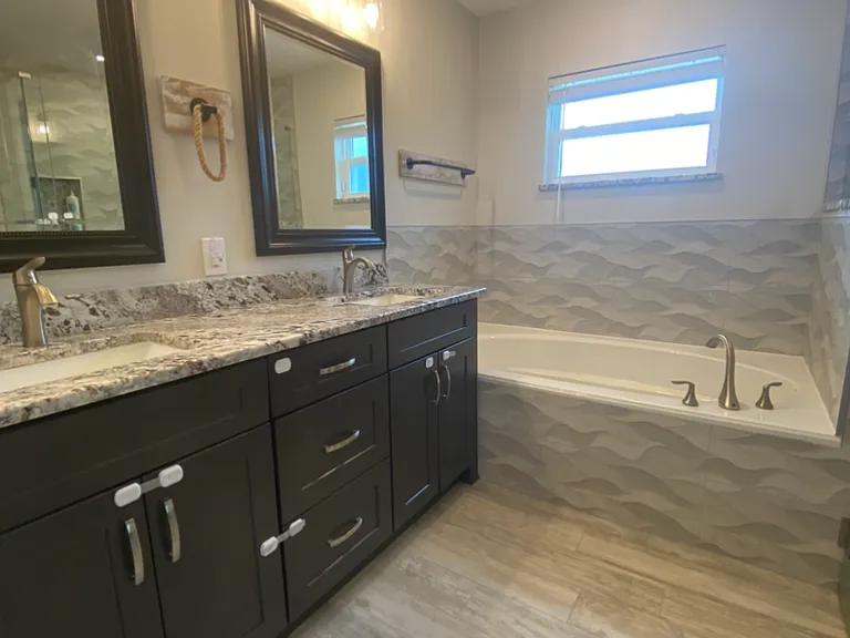 Primary bathroom -double vanity, granite counter top, garden tub, tile floor