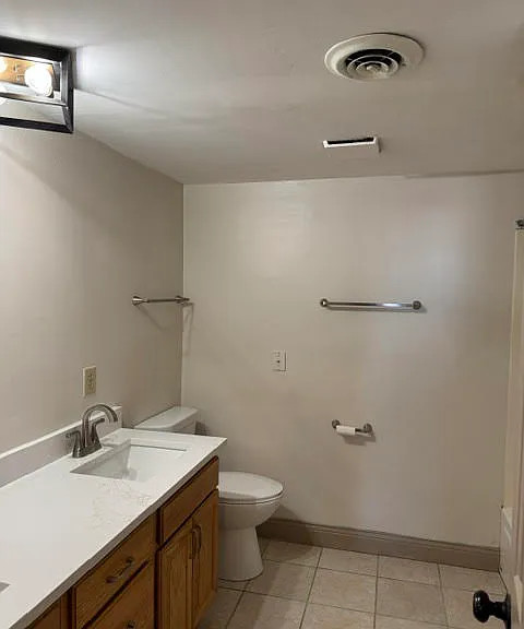 Bathroom with double sinks. New countertop, sinks and faucets.