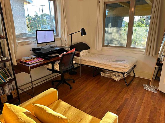 Room shown here with possible configuration for a bed, desk, armchair, and storage. Room is currently unfurnished.