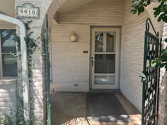 Front door.

Large, heavy gate with latch in front.