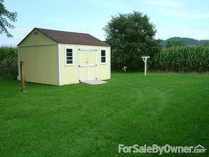 Back Yard
						:
						Back yard has a clothes line, shed and post for hammocks(to left of shed)