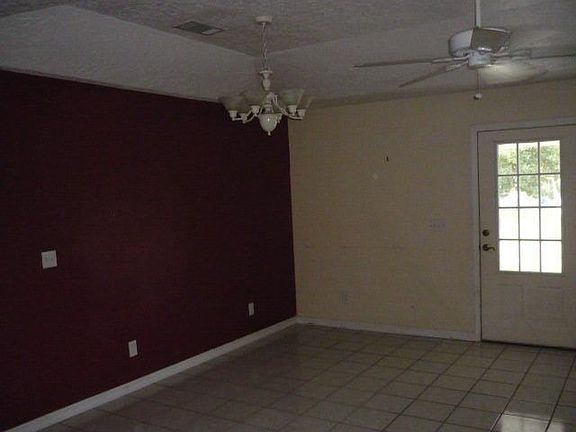 Larger shot of kitchen/dining area