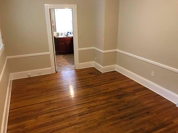 Dining room or office, connects to kitchen.