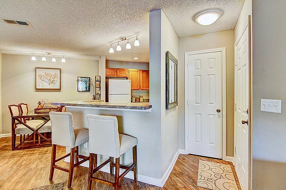 Entry way with hardwood-style flooring