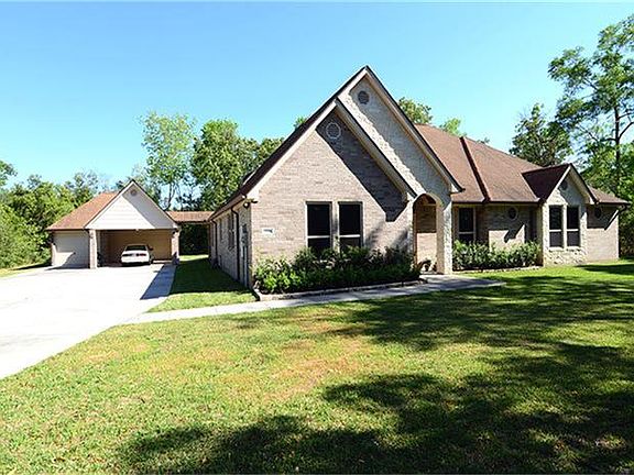  The full acre lot allows for a spacious front yard with plenty of room left in the back. The entire yard is quite private.