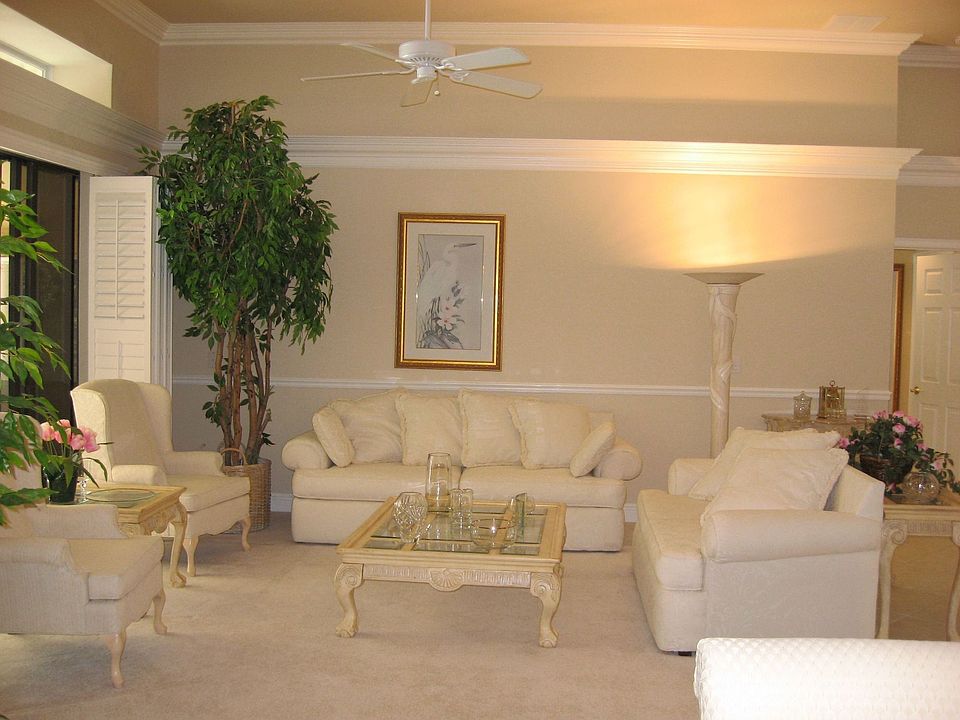 10 FORMAL LIVING ROOM-WET BAR ROUGHED IN BEHIND TREE